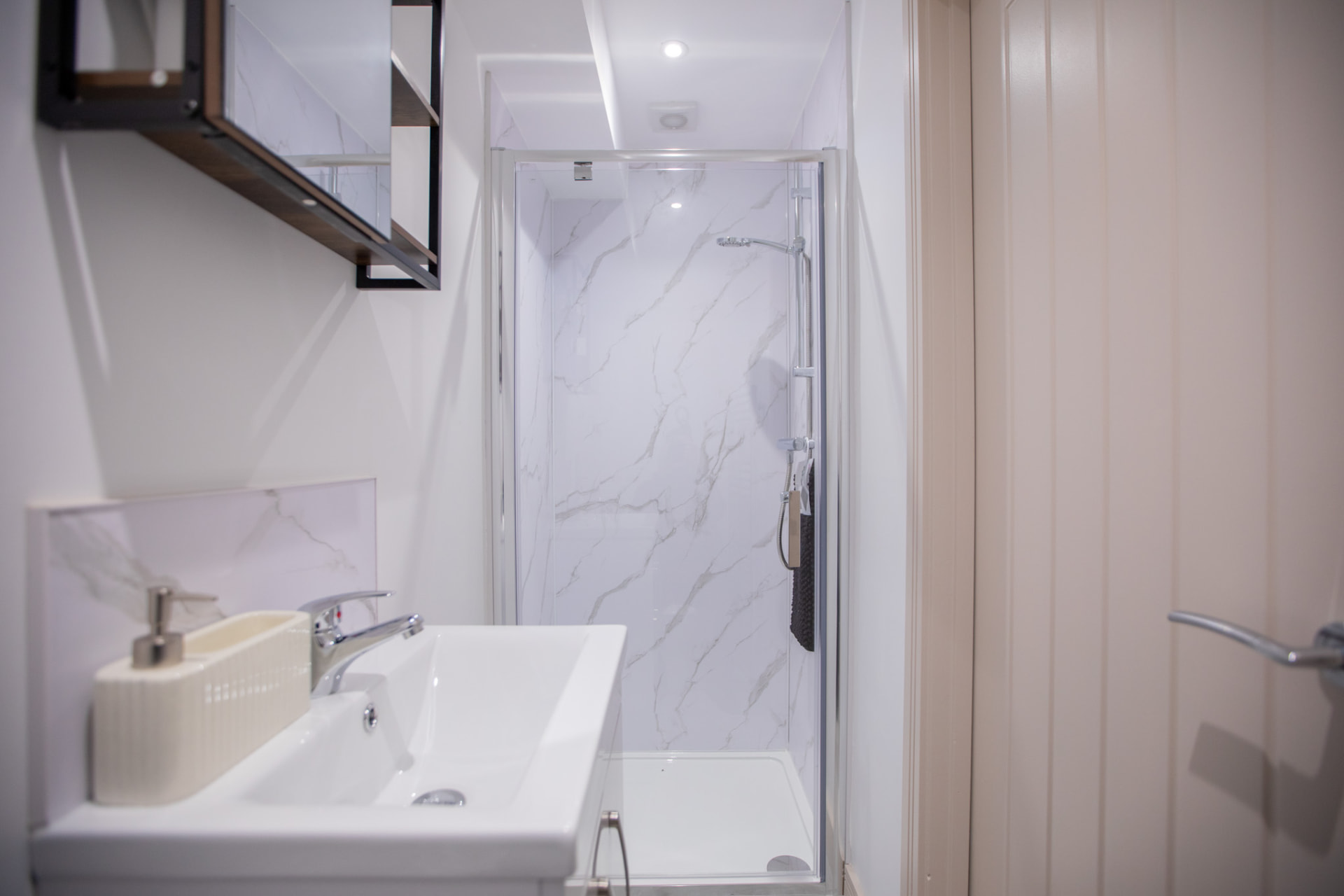 Barton Road after — marble shower room